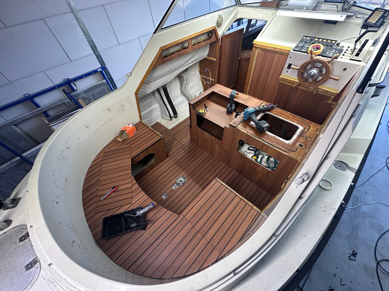 Marine vinyl flooring installed in yacht cabin interior — teak vinyl flooring boat application