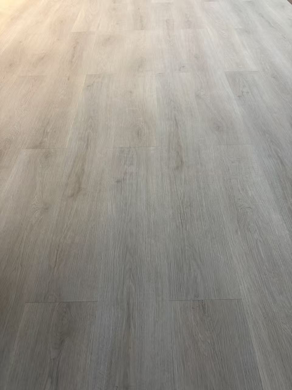 SPC vinyl flooring installed in UAE residential project — warm wood tone Dubai interior